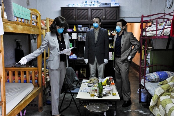 Photo: Still of Marion Cotillard and Chin Han in Contagion