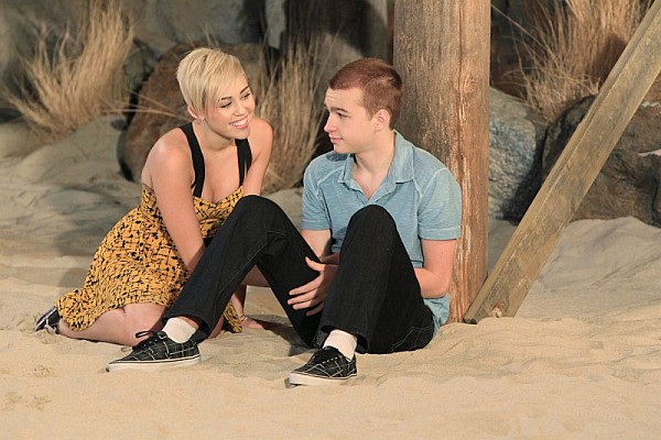 Still of Angus T. Jones and Miley Cyrus in Two and a Half Men