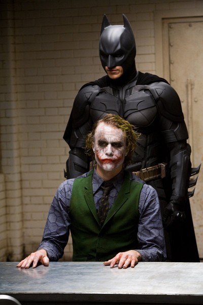 Still of Christian Bale and Heath Ledger in The Dark Knight