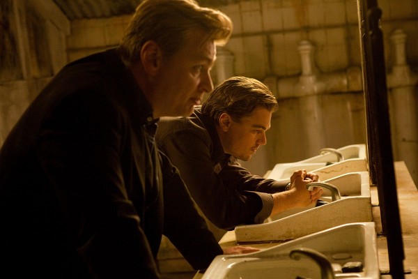 Still of Leonardo DiCaprio and Christopher Nolan in Inception